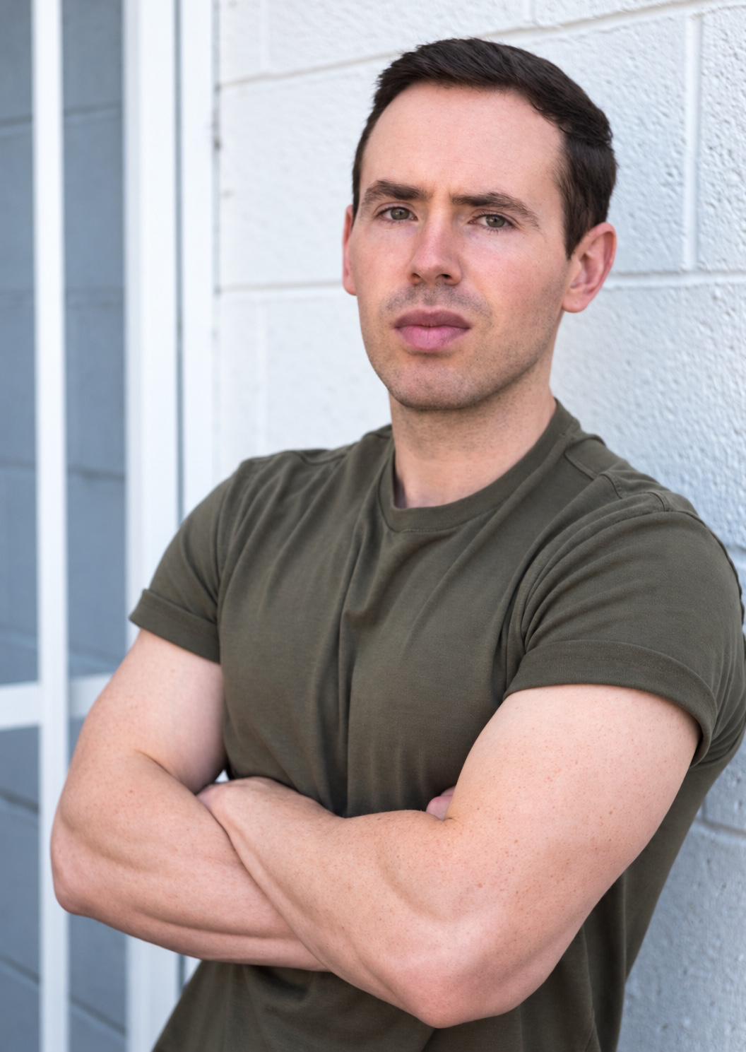 Matthew Maynard portrait in olive shirt